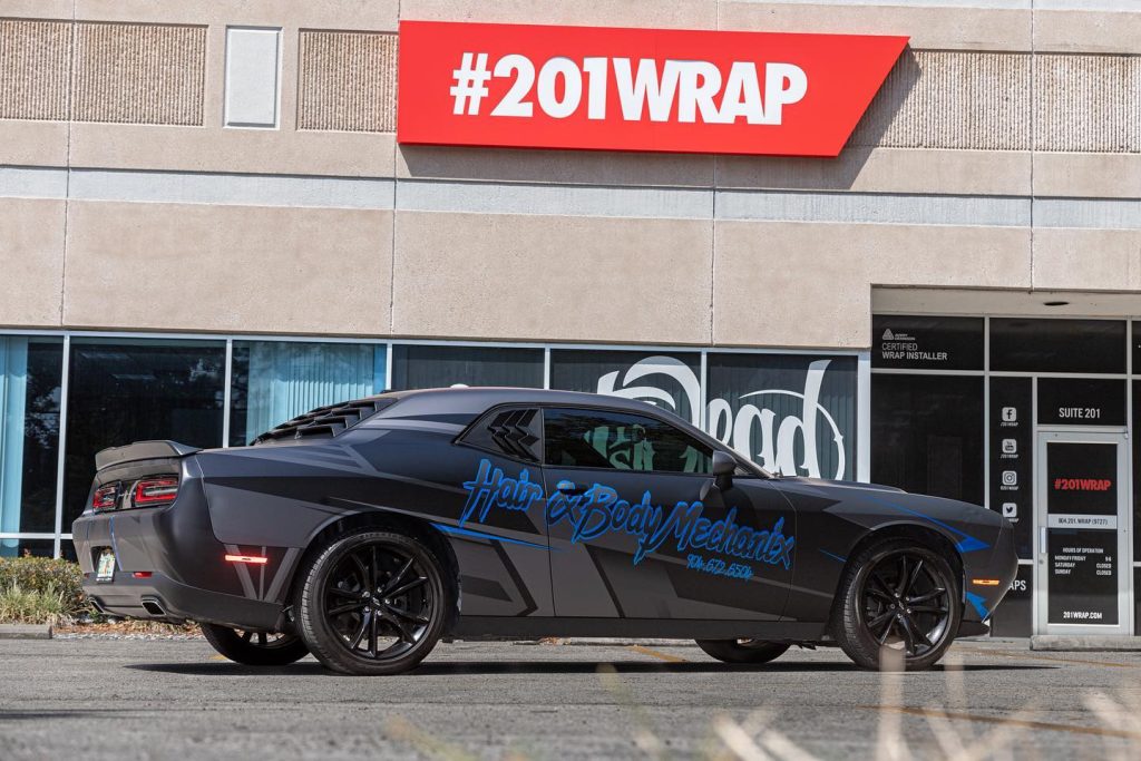 A Dodge Challenger car wrapped in graphics.