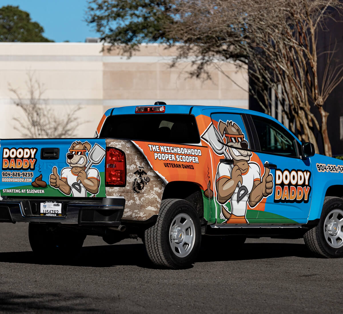 Chevrolet truck wrapped with a local business advertisement.
