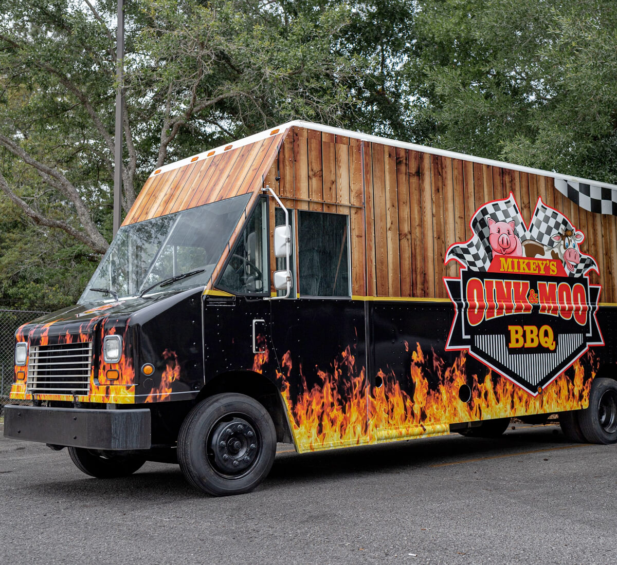BBQ food truck wrapped with business graphics